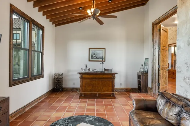 a bedroom with furniture and a wooden floor