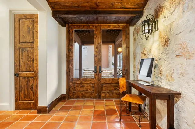 a bathroom with a granite countertop sink mirror and a shower