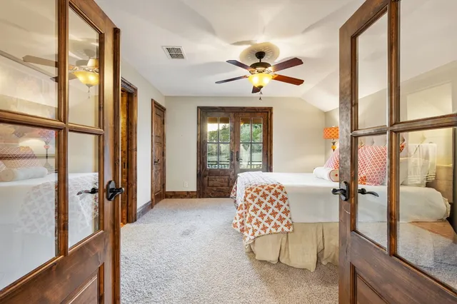 a view of a porch with furniture and floor to ceiling window