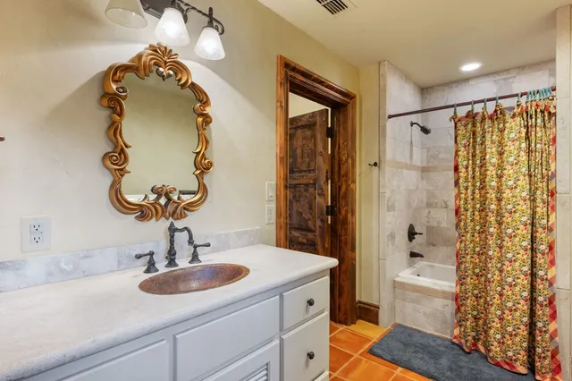 a view of a terrace with furniture and a yard