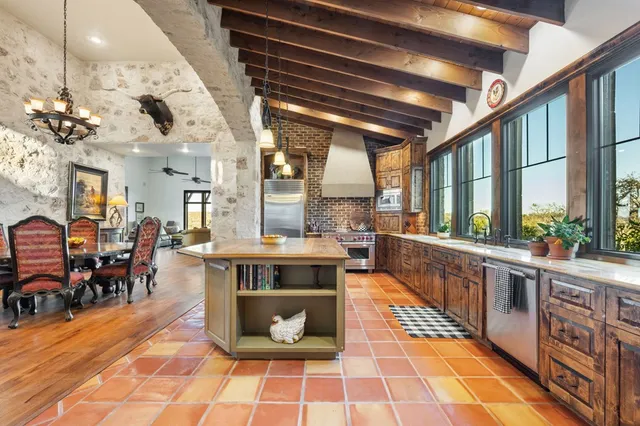 a living room with a fireplace and a walk in closet