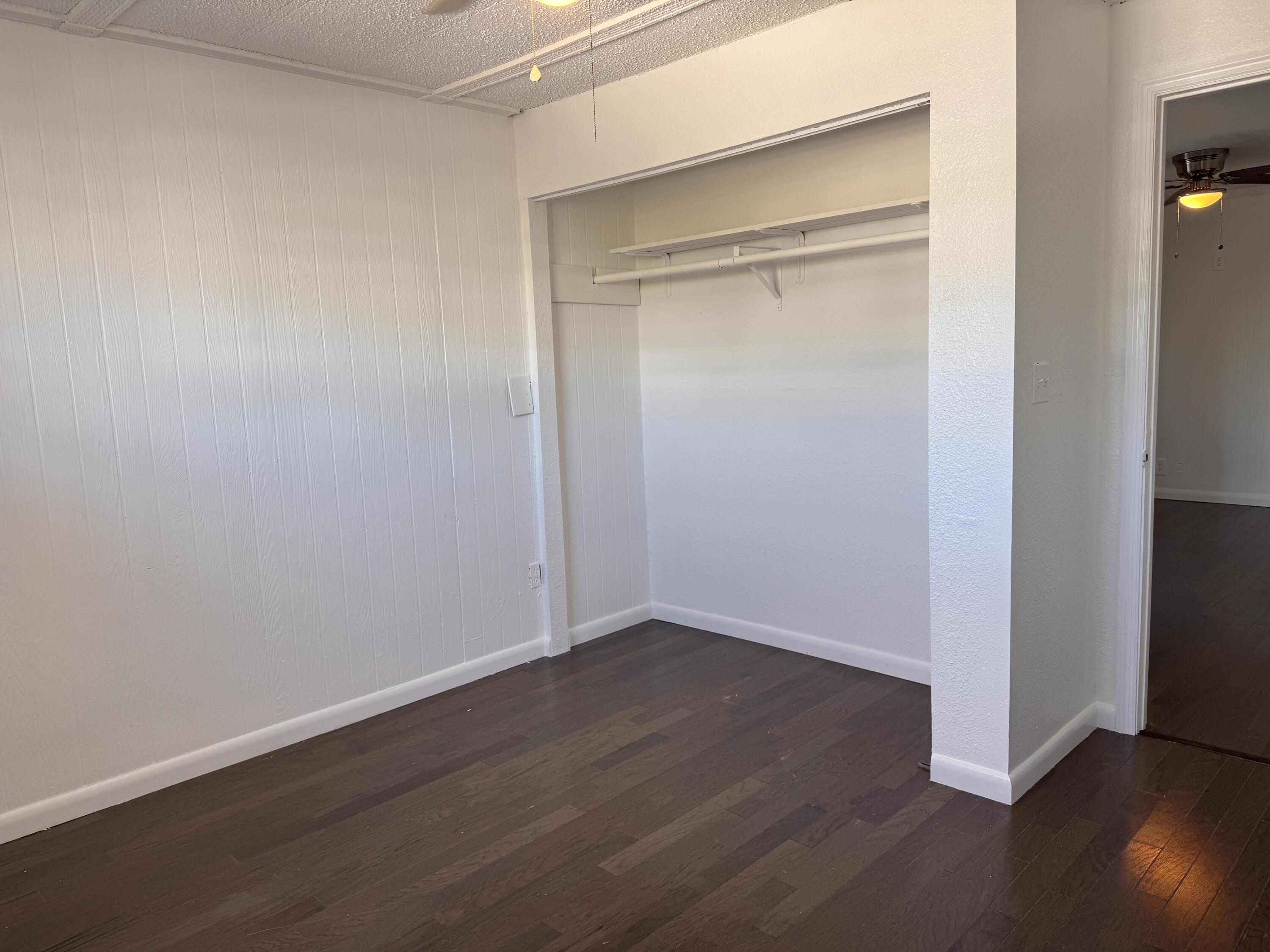 969 Plantation Road Key Largo, FL 33037 - Photo 7 of 26 an empty room with wooden floor