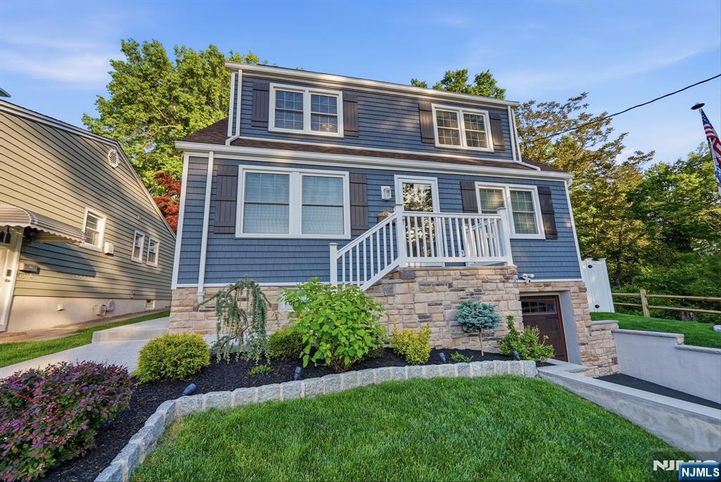 44 Alpine Place Kearny, NJ 07032 - Photo 5 of 50 a front view of a house with a yard