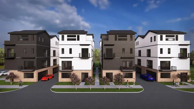 a front view of residential houses with outdoor space