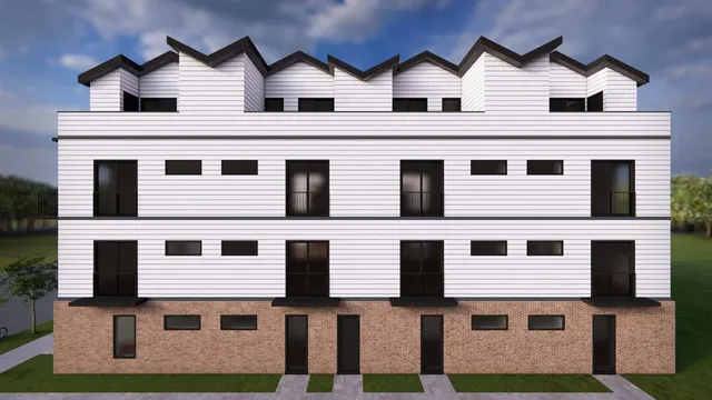 a view of a white building with many windows