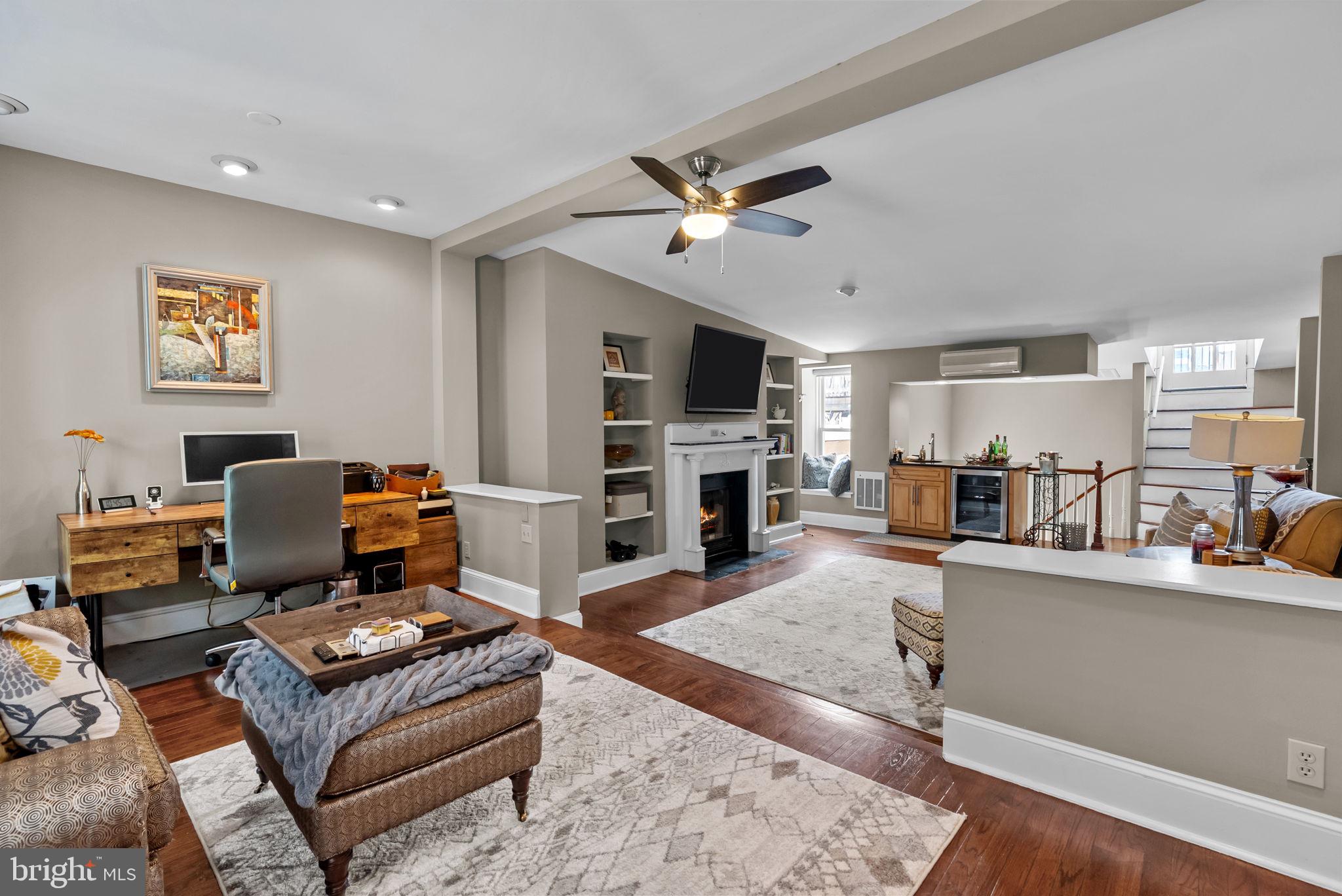 1518 Mt Vernon Street, Unit 3 Philadelphia, PA 19130 - Photo 20 of 24 a living room with furniture and a fireplace