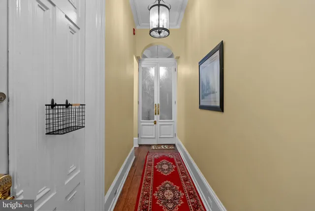 a view of hallway with wooden floor