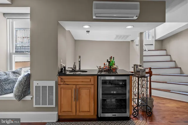 a kitchen with stainless steel appliances granite countertop a stove and cabinets