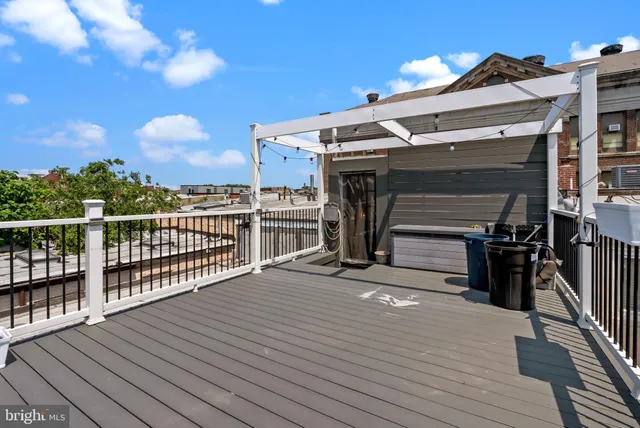 a view of a balcony with wooden floor