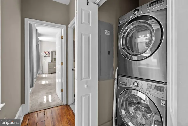 a view of a hallway with washer and dryer