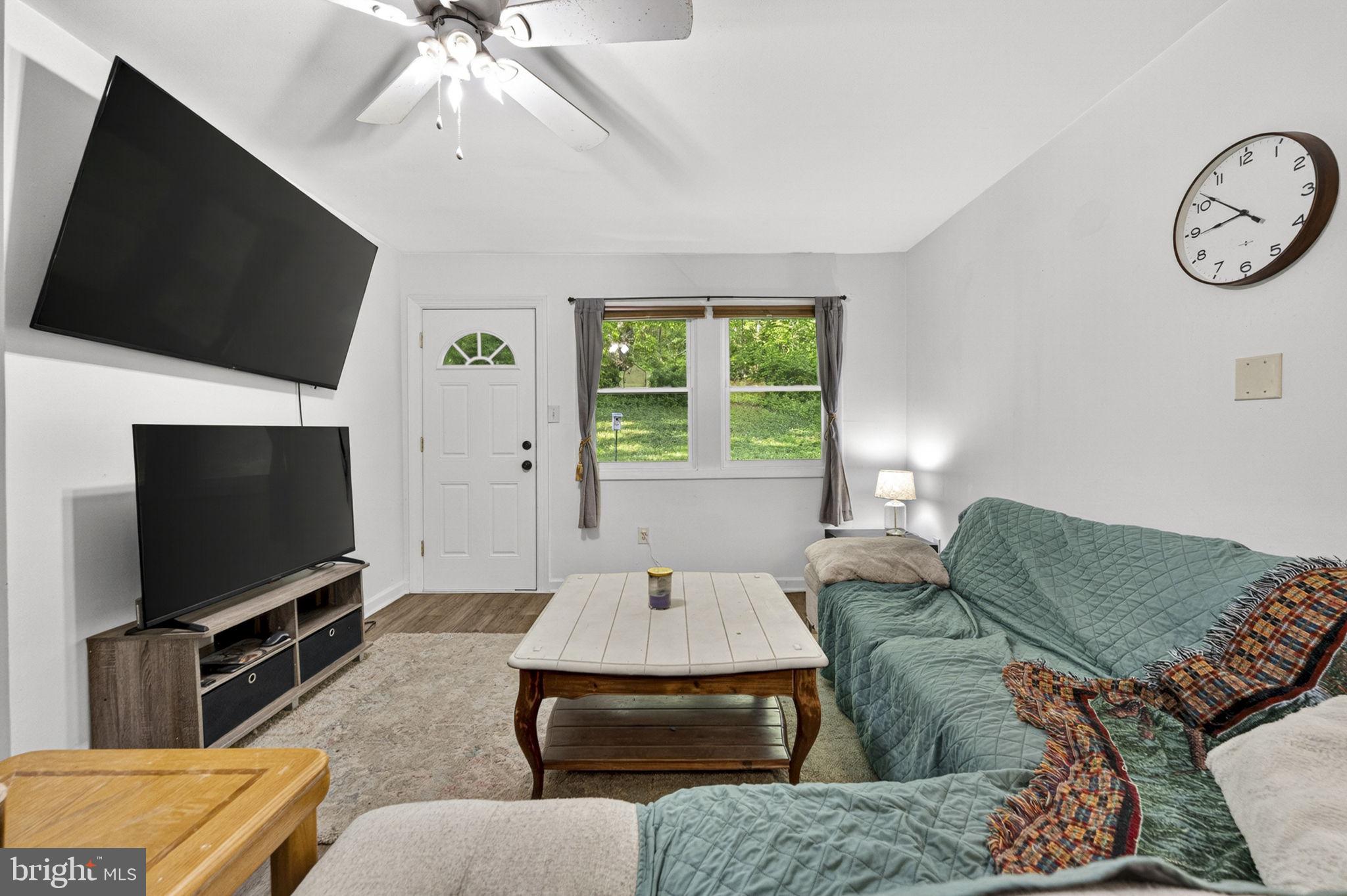 673 Creek Road Front Royal, VA 22630 - Photo 22 of 64 a living room with furniture and a flat screen tv
