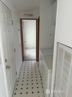 a kitchen with a stove a sink and a refrigerator