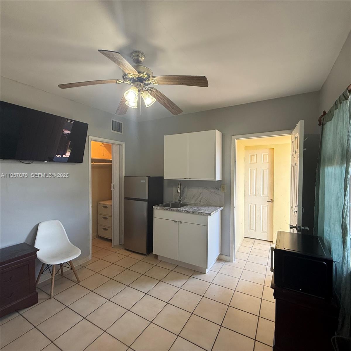 275 West 16th Street Hialeah, FL 33010 - Photo 1 of 17 a kitchen with a cabinets and a stove top oven