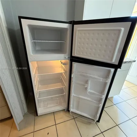 a view of walk in closet with wooden floor