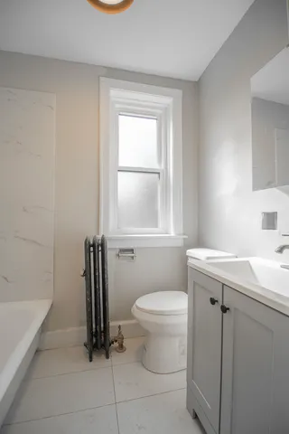 a bathroom with a sink toilet and a bathtub