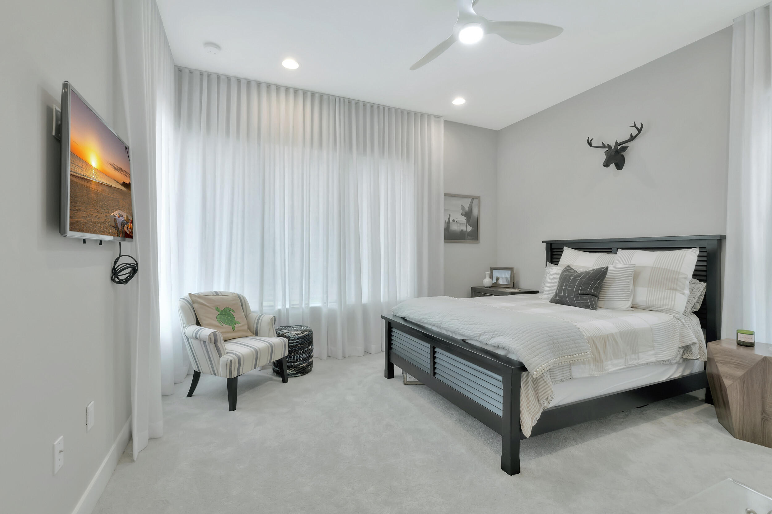 17118 Aquavera Way Boca Raton, FL 33496 - Photo 13 of 53 a spacious bedroom with a bed and a chair
