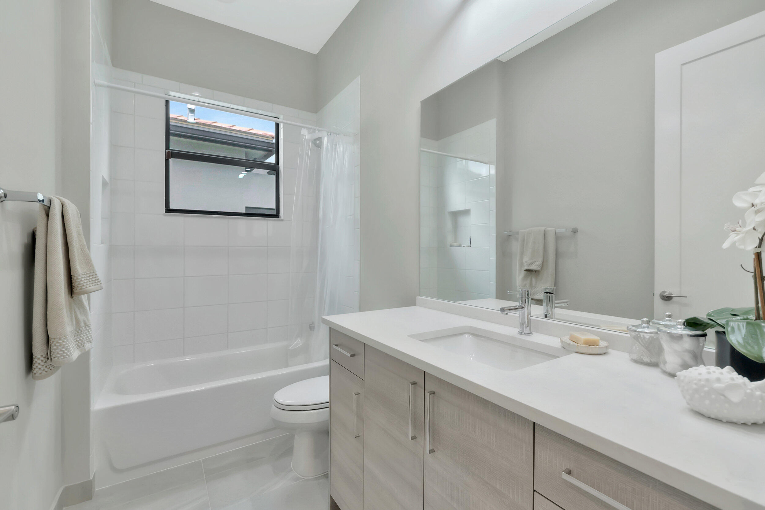 17118 Aquavera Way Boca Raton, FL 33496 - Photo 14 of 53 a bathroom with a granite countertop sink a toilet and shower