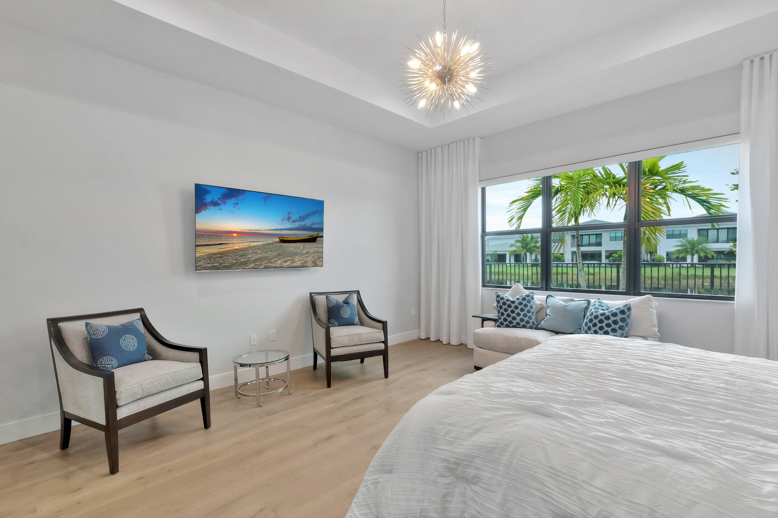 17118 Aquavera Way Boca Raton, FL 33496 - Photo 16 of 53 a bedroom with a bed and a chair