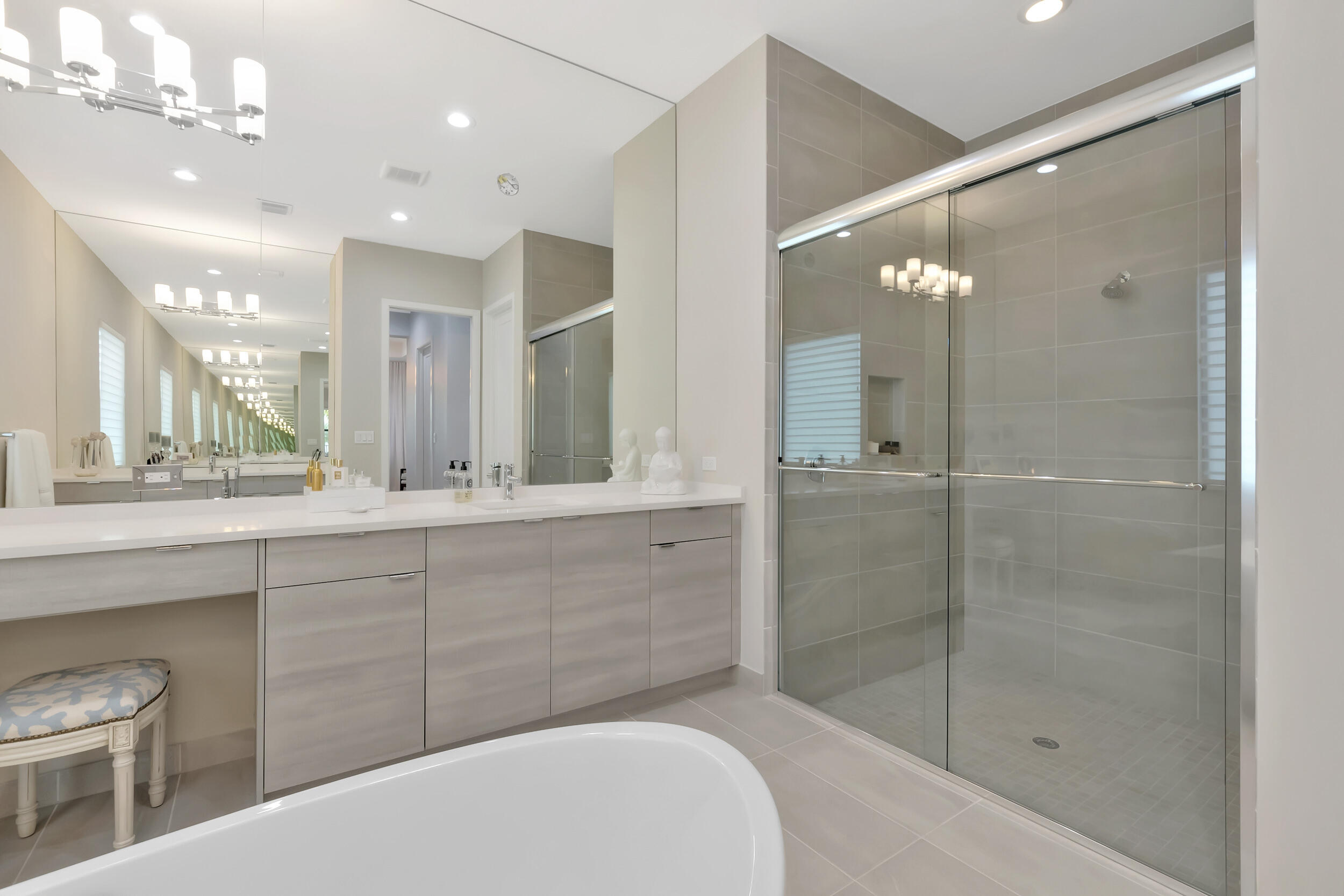 17118 Aquavera Way Boca Raton, FL 33496 - Photo 18 of 53 a bathroom with a shower a sink and mirror