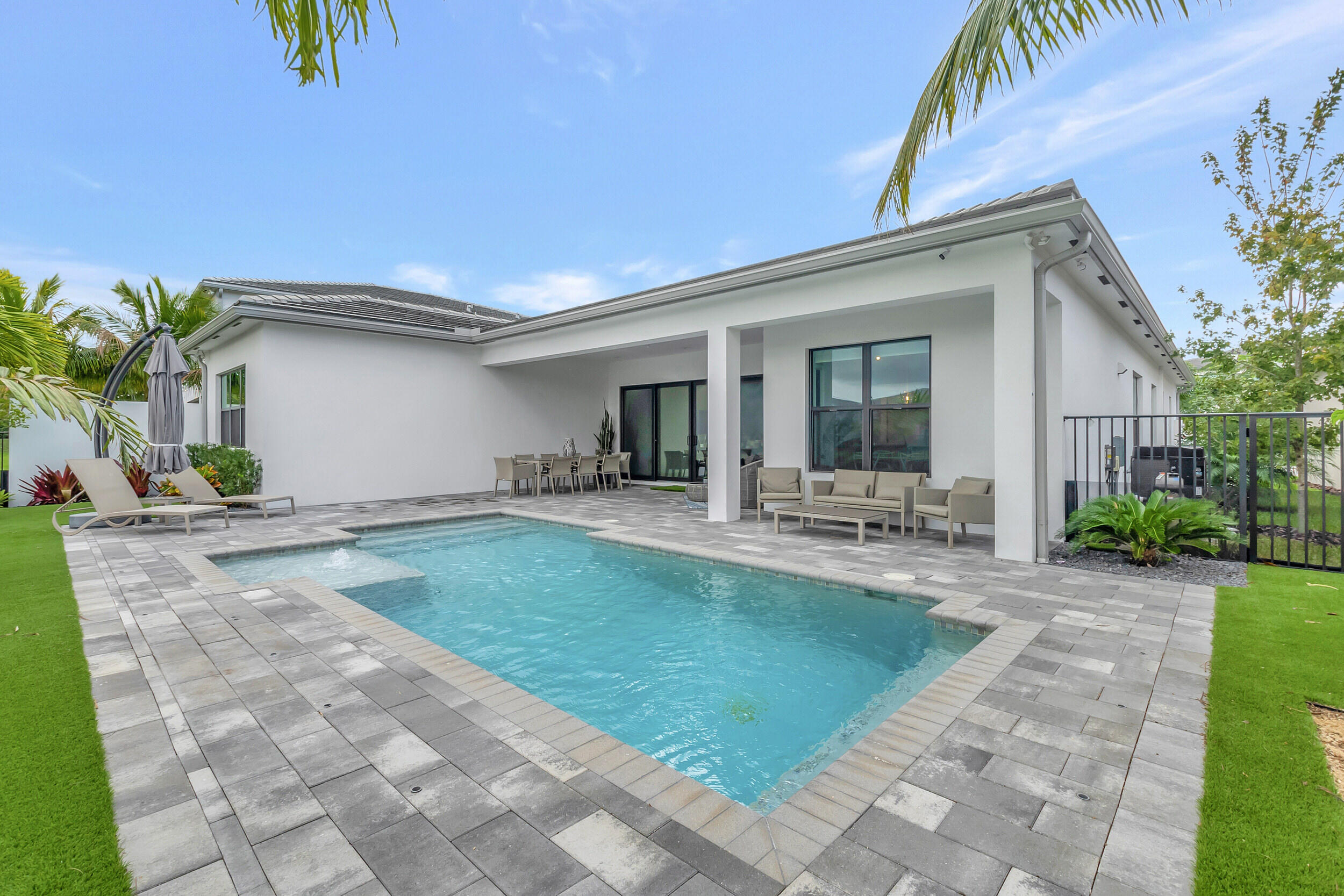 17118 Aquavera Way Boca Raton, FL 33496 - Photo 23 of 53 a view of a house with backyard porch and sitting area