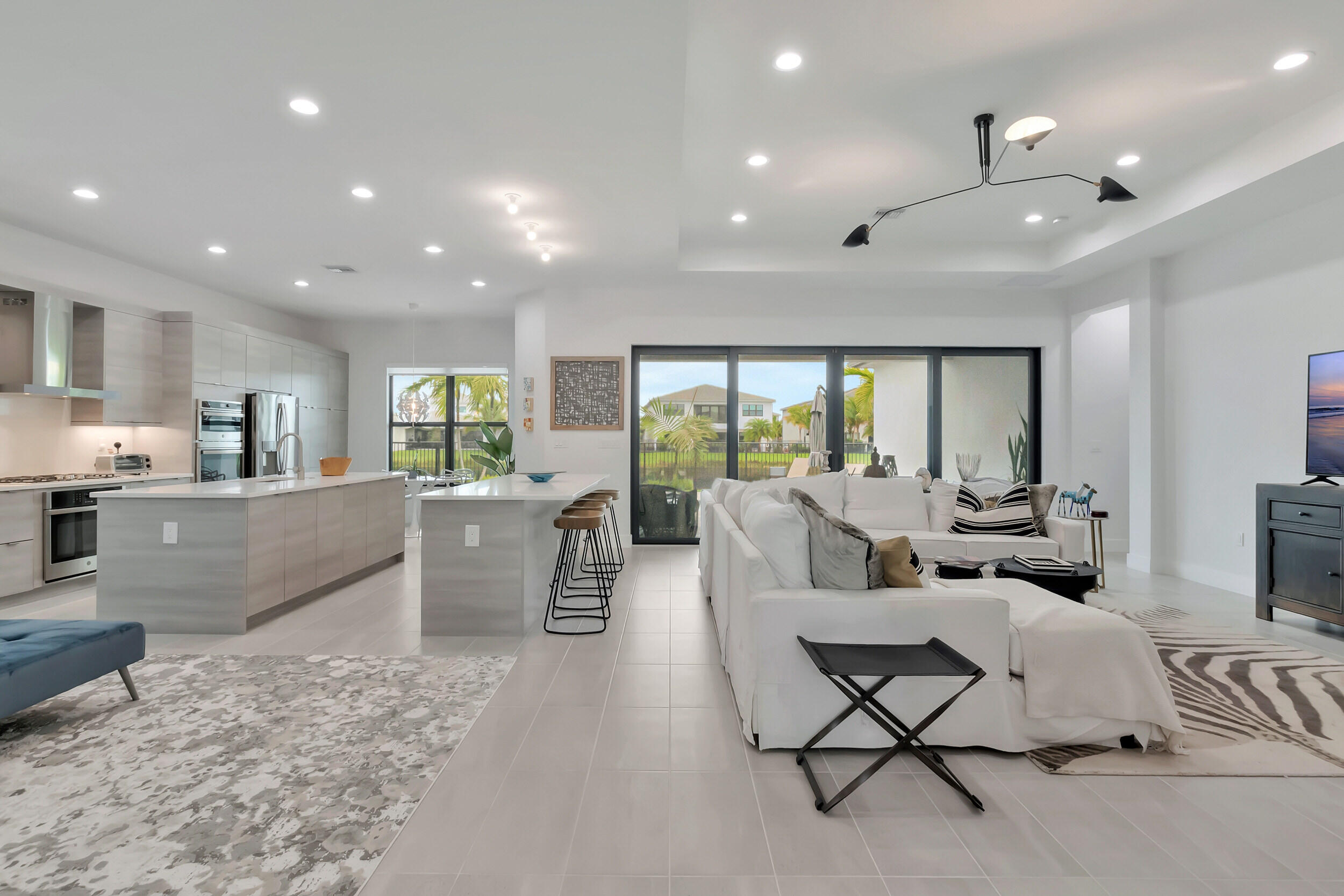 17118 Aquavera Way Boca Raton, FL 33496 - Photo 3 of 53 a living room with furniture and a large window with outer view