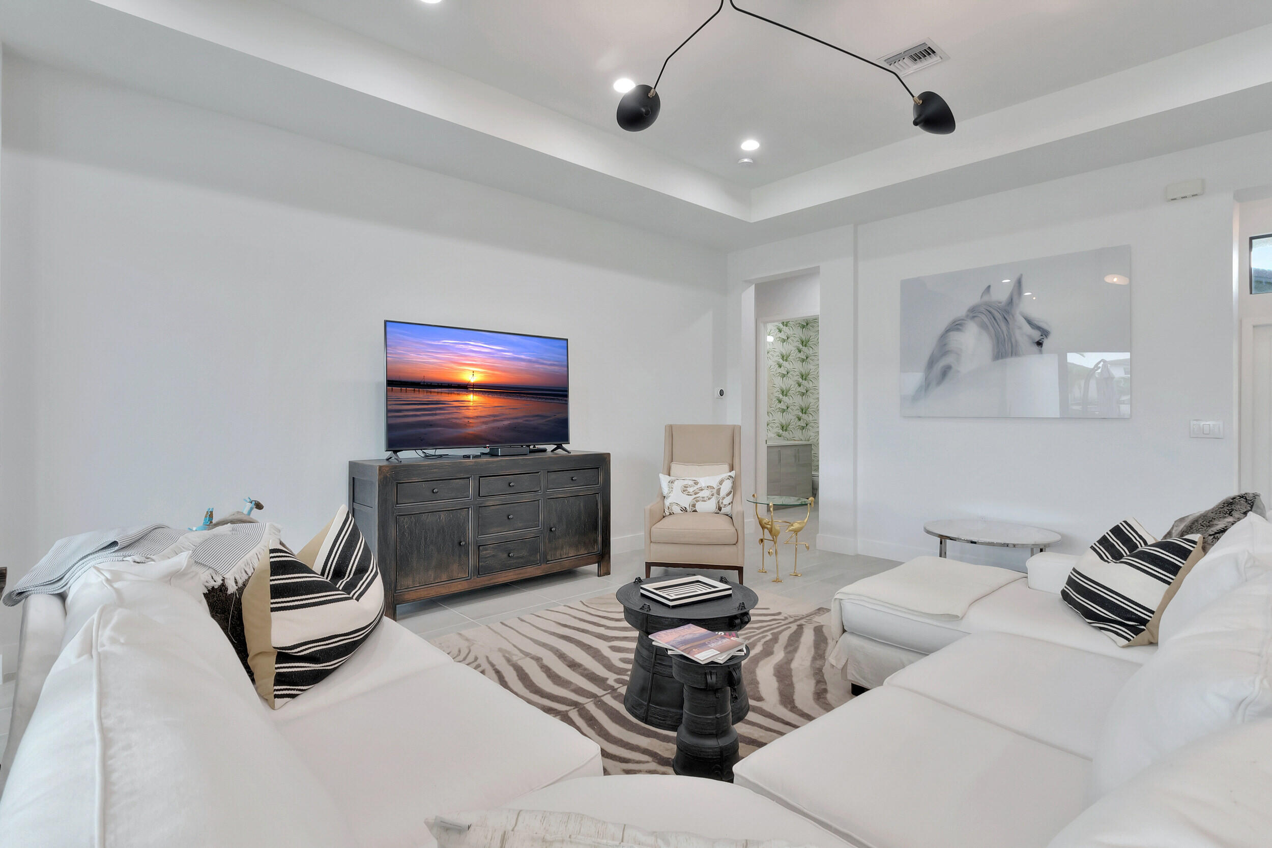 17118 Aquavera Way Boca Raton, FL 33496 - Photo 4 of 53 a living room with furniture and a flat screen tv