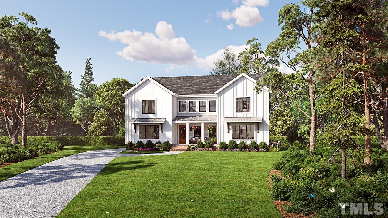 110 Rosemont Lane Chapel Hill, NC 27516 - Photo 1 of 4 a front view of a house with a garden and trees