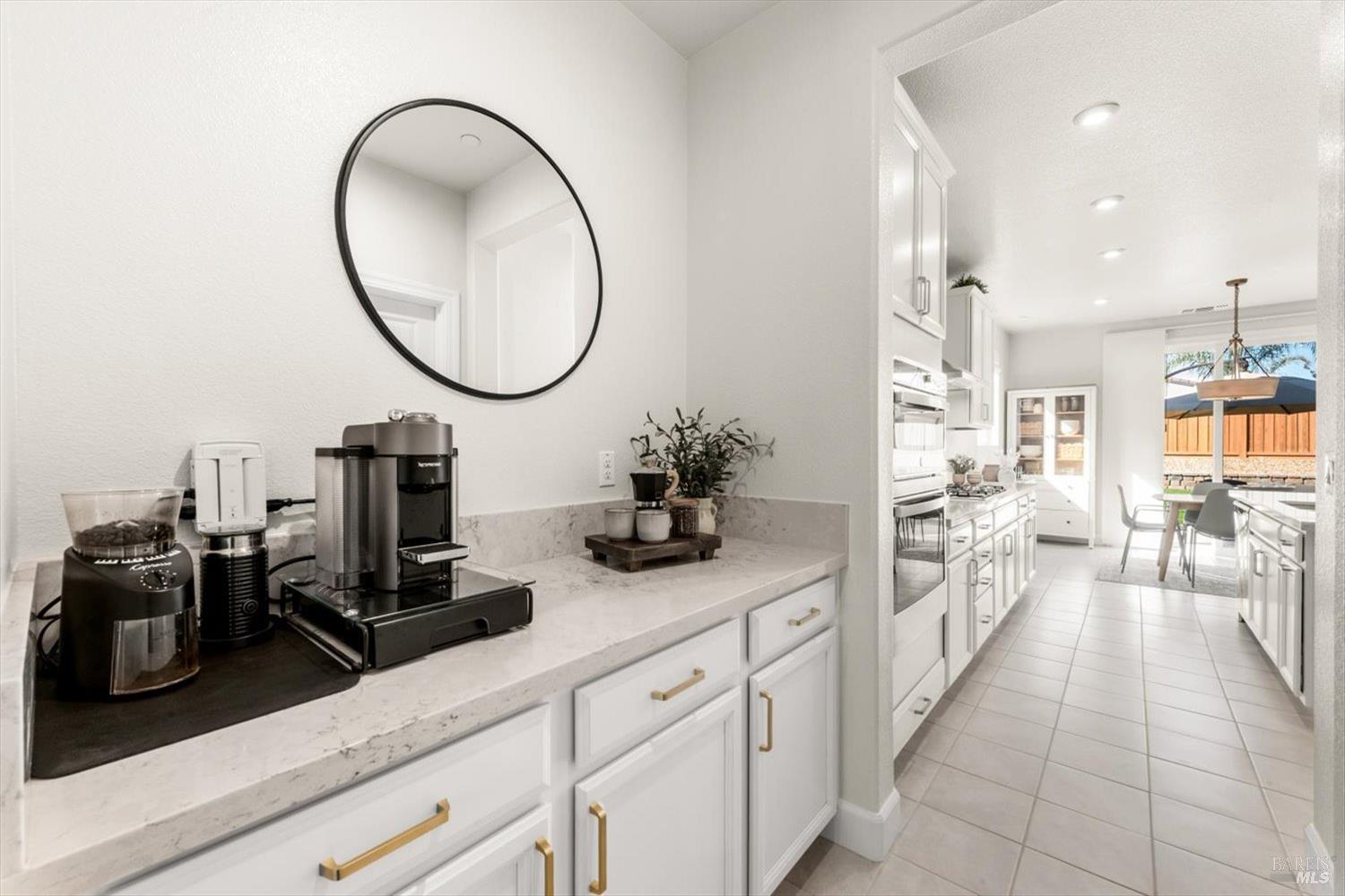 710 Fielding Way Dixon, CA 95620 - Photo 20 of 104 a kitchen with sink cabinets and a view of living room