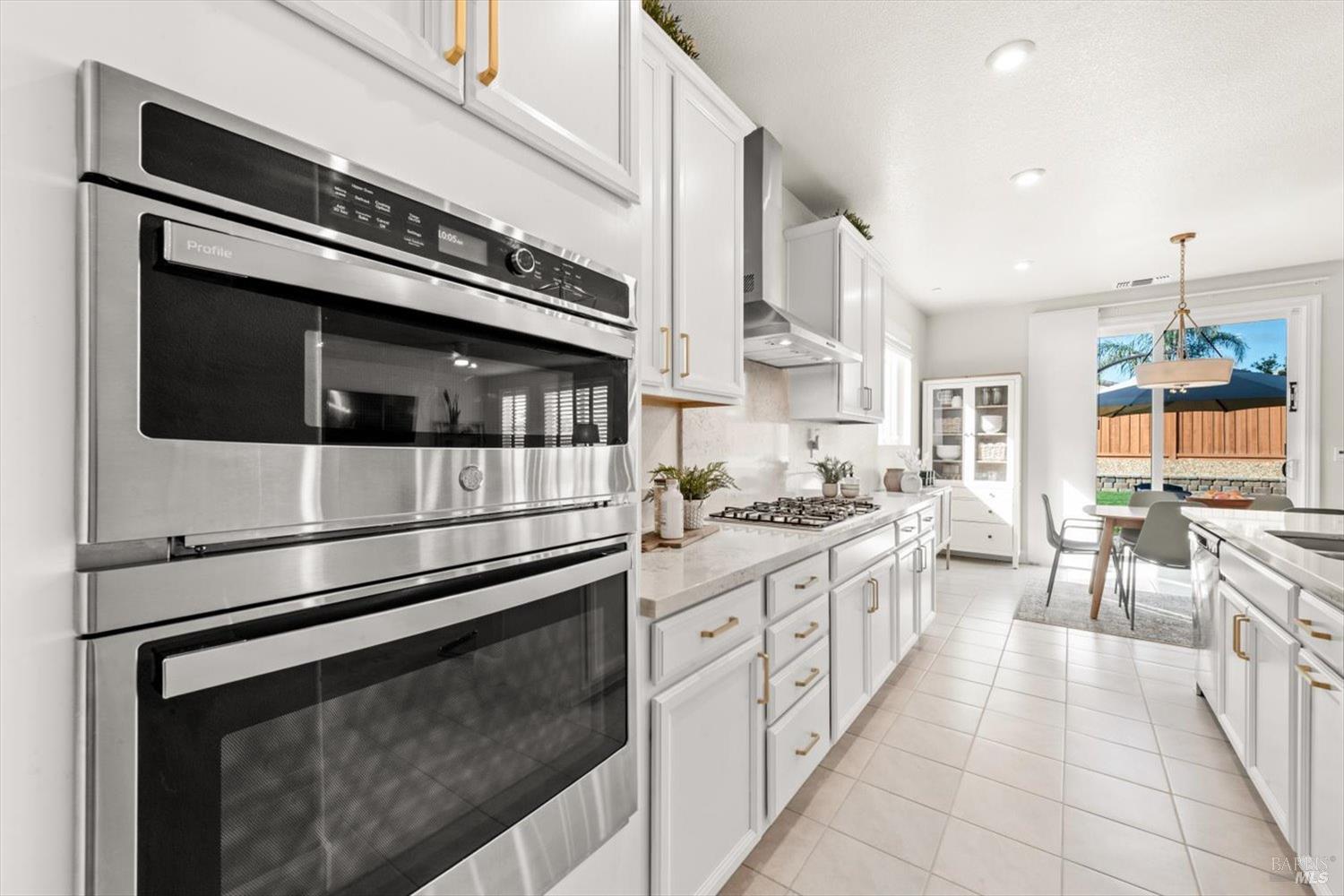 710 Fielding Way Dixon, CA 95620 - Photo 23 of 104 a kitchen with stainless steel appliances granite countertop a stove and a microwave