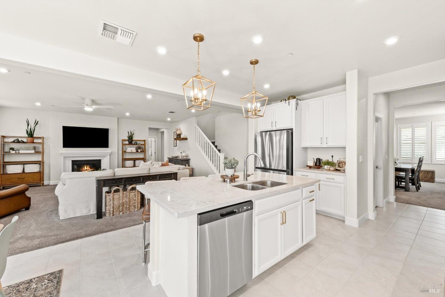 710 Fielding Way Dixon, CA 95620 - Photo 26 of 104 a open kitchen with stainless steel appliances kitchen island a large counter tops and white cabinets