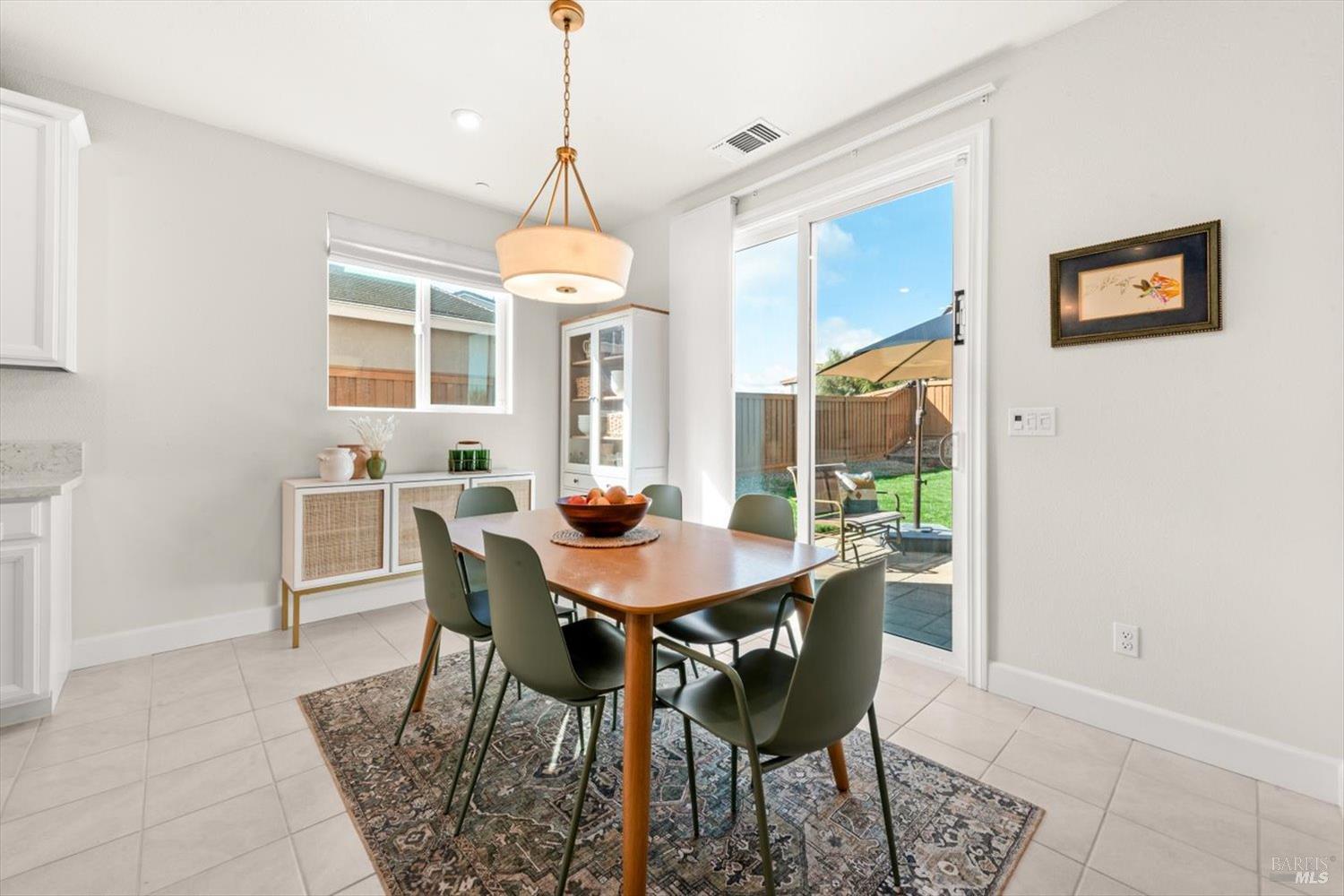 710 Fielding Way Dixon, CA 95620 - Photo 31 of 104 a view of a dining room with furniture window and wooden floor
