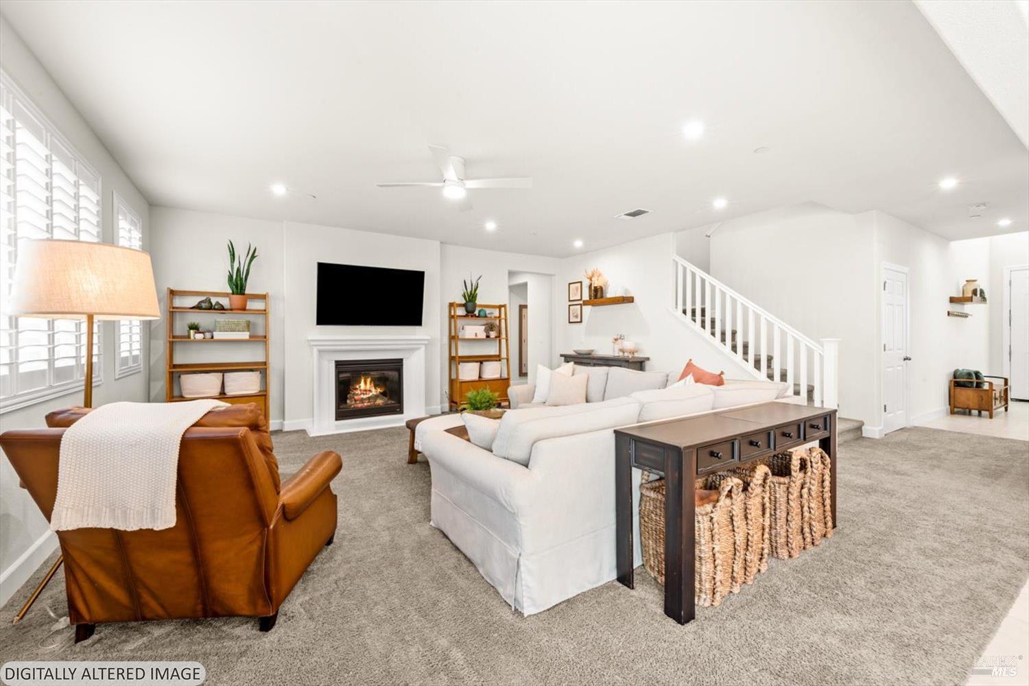 710 Fielding Way Dixon, CA 95620 - Photo 34 of 104 a living room with furniture a fireplace and a flat screen tv