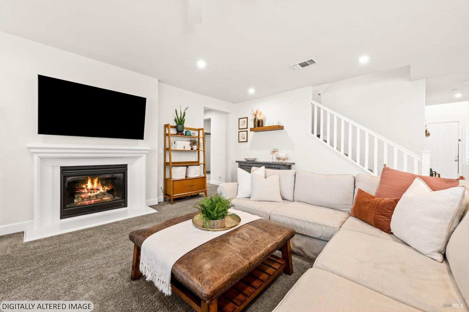 710 Fielding Way Dixon, CA 95620 - Photo 38 of 104 a living room with furniture a flat screen tv and a fireplace