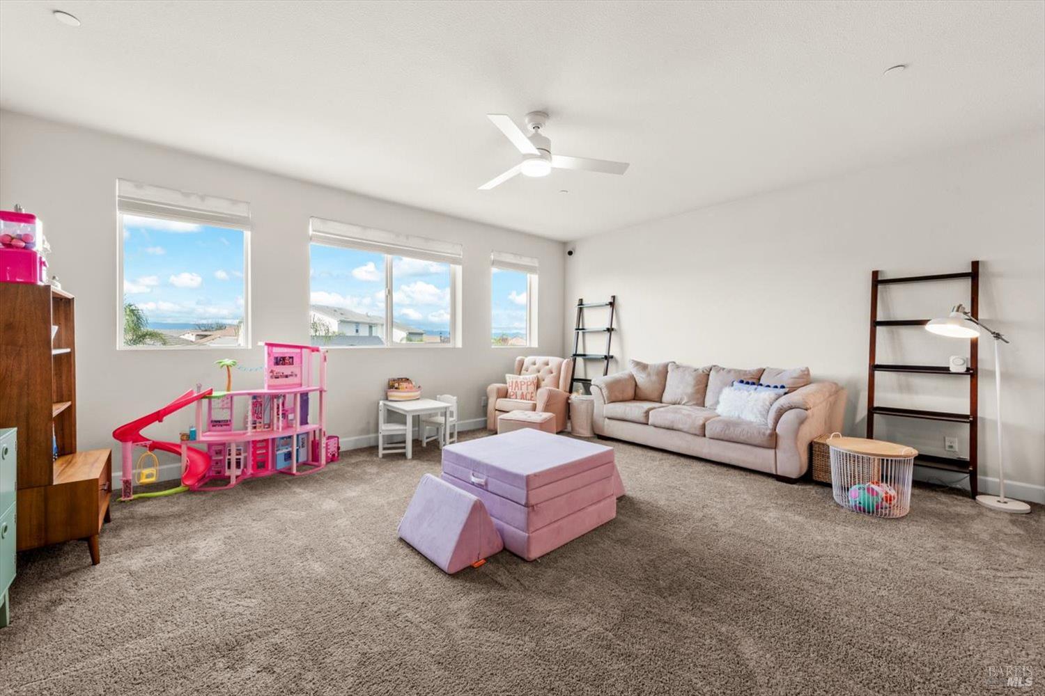 710 Fielding Way Dixon, CA 95620 - Photo 57 of 104 a spacious bedroom with a bed and a couch