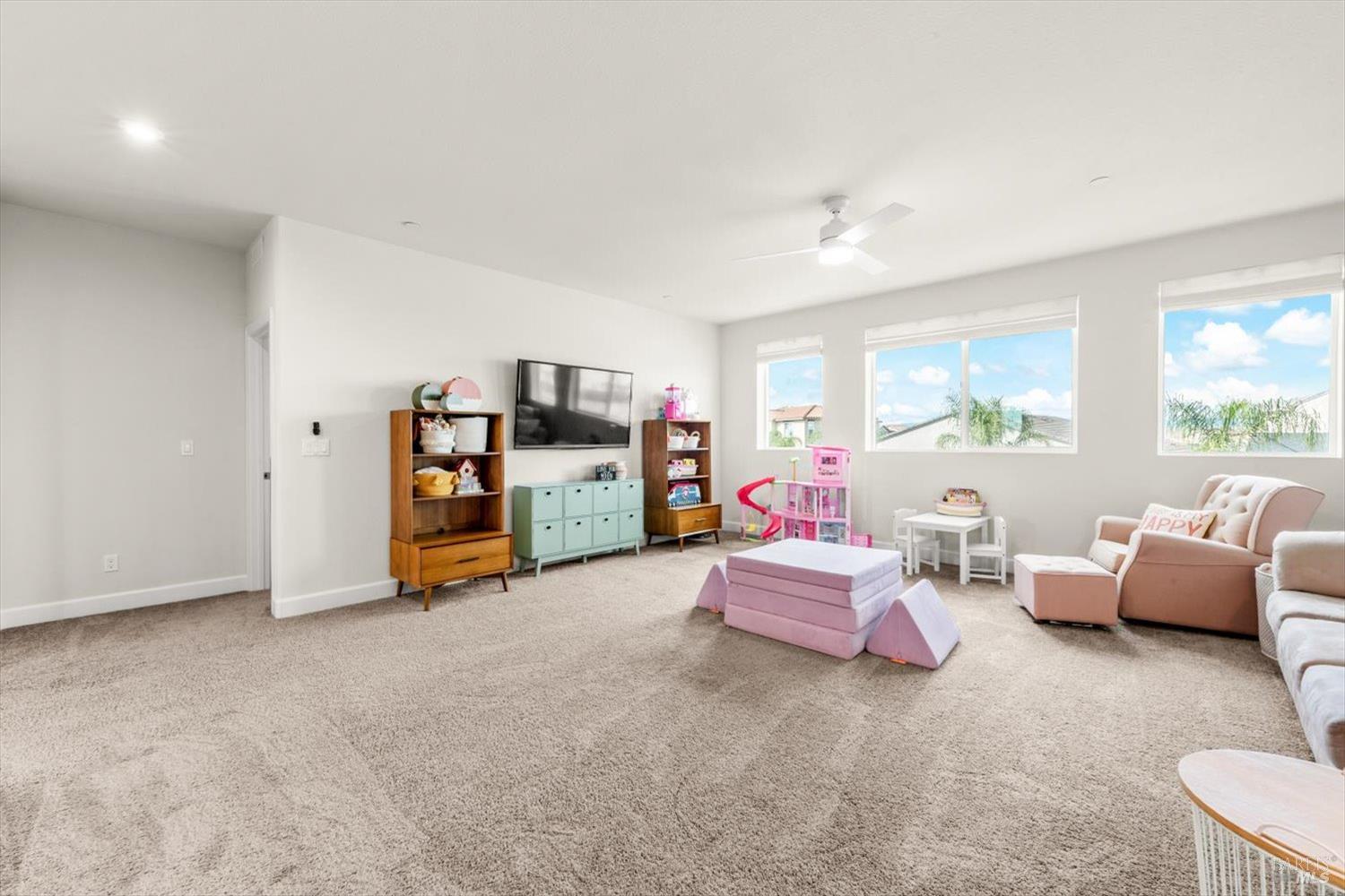 710 Fielding Way Dixon, CA 95620 - Photo 58 of 104 a living room with furniture and a flat screen tv