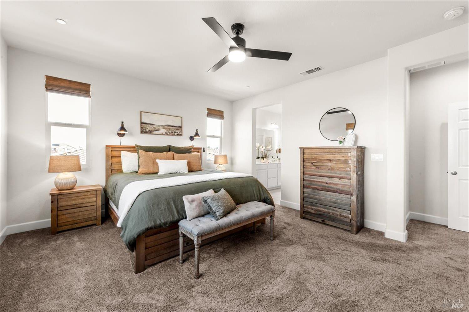 710 Fielding Way Dixon, CA 95620 - Photo 60 of 104 a bedroom with a bed and ceiling fan
