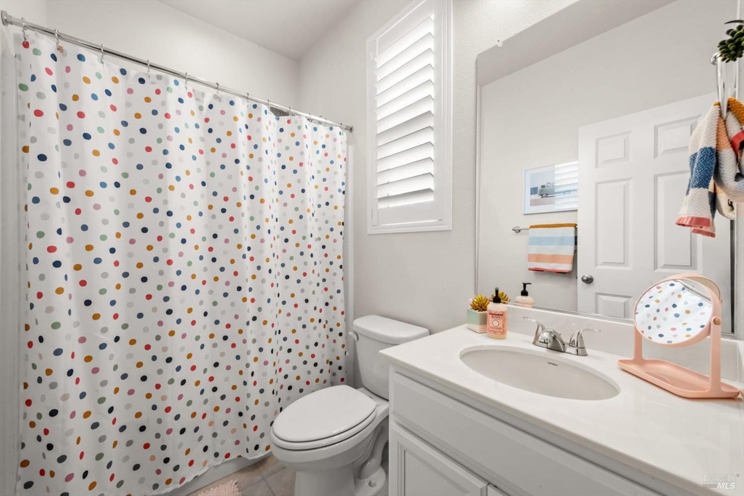 710 Fielding Way Dixon, CA 95620 - Photo 70 of 104 a bathroom with a sink toilet and a mirror