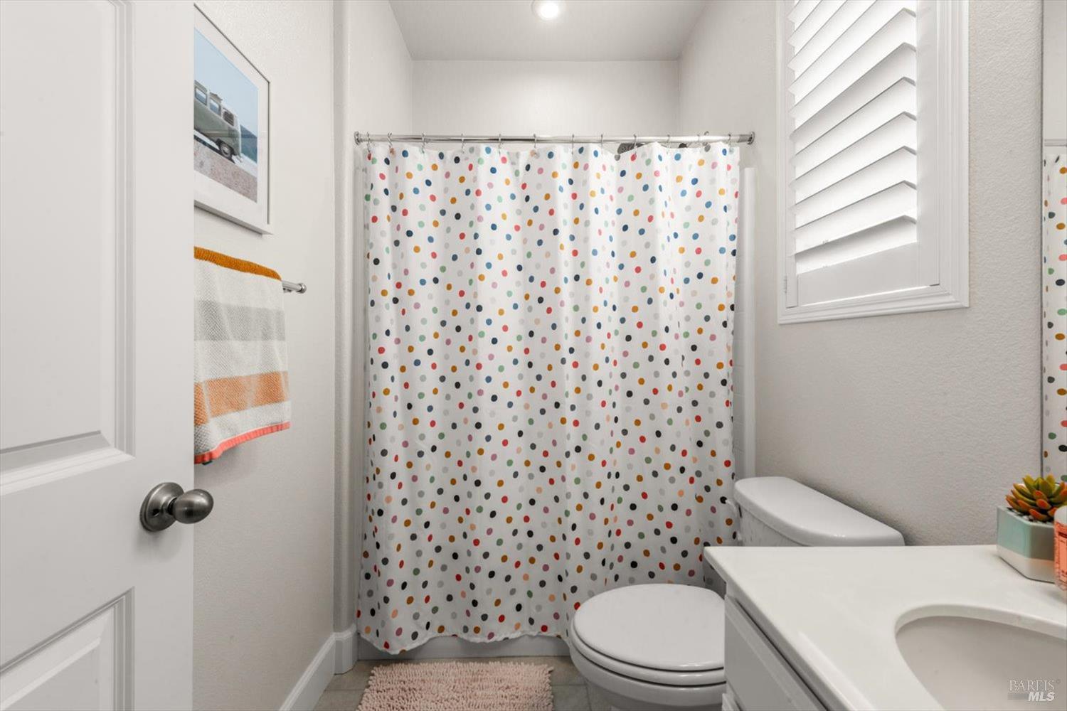 710 Fielding Way Dixon, CA 95620 - Photo 71 of 104 a white toilet sitting next to a shower curtain