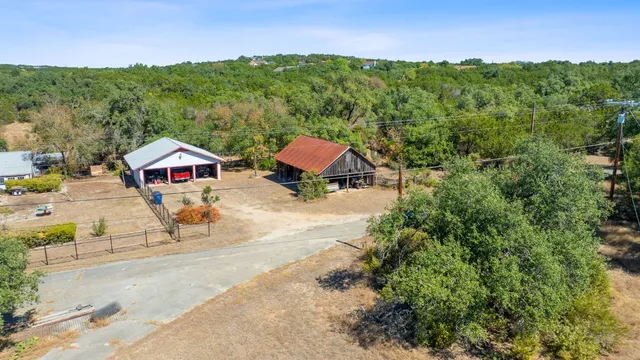 a view of house with outdoor space and trees
