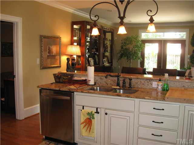 706 Tower Street Raleigh, NC 27605 - Photo 23 of 23 Kitchen with gorgeous granite....open floor plan to den/living room, breakfast/ dining area, easily opens to outdoor space.