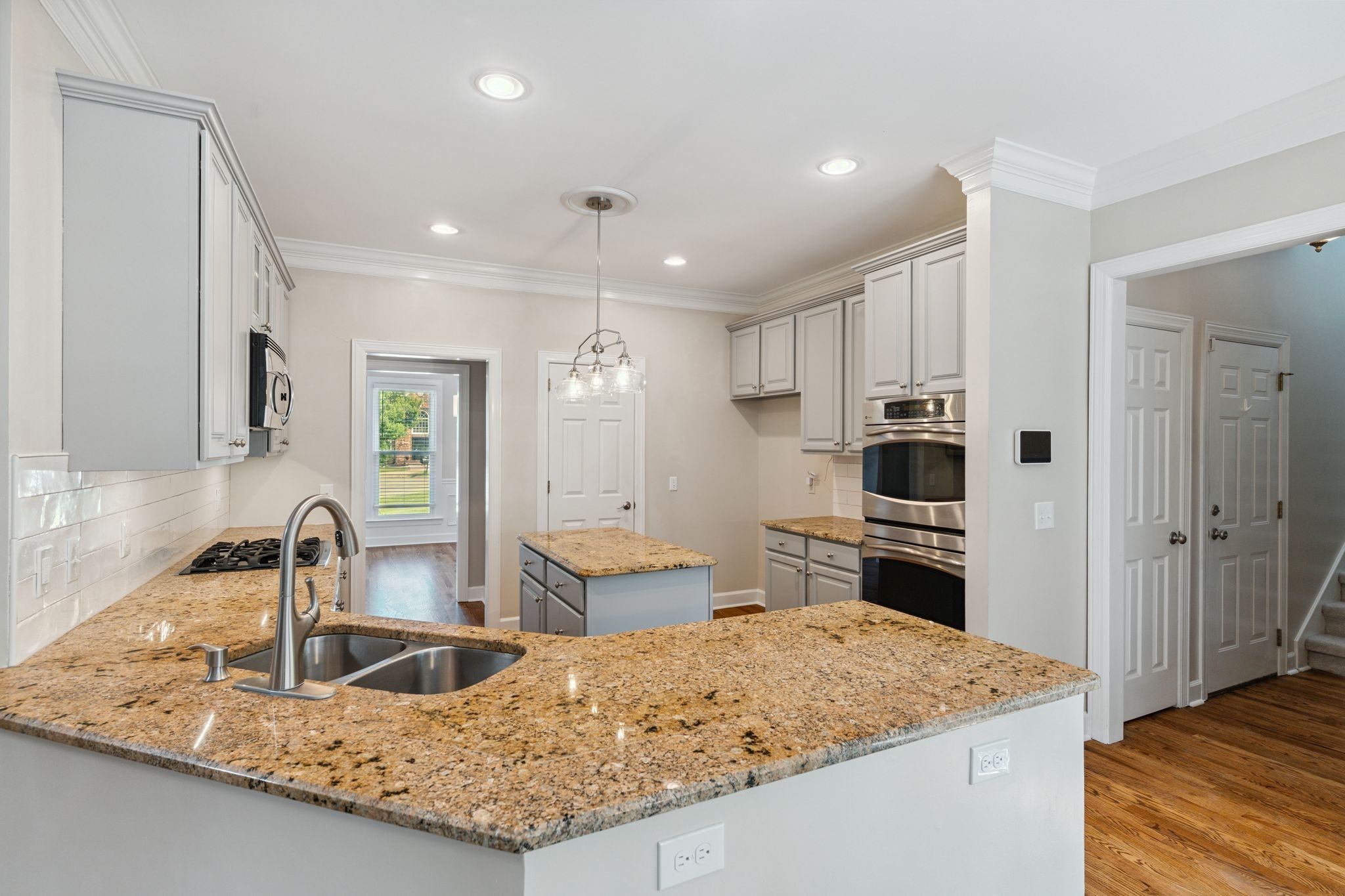 2105 Chels Way Old Hickory, TN 37138 - Photo 15 of 47 a kitchen with stainless steel appliances granite countertop a sink stove and refrigerator