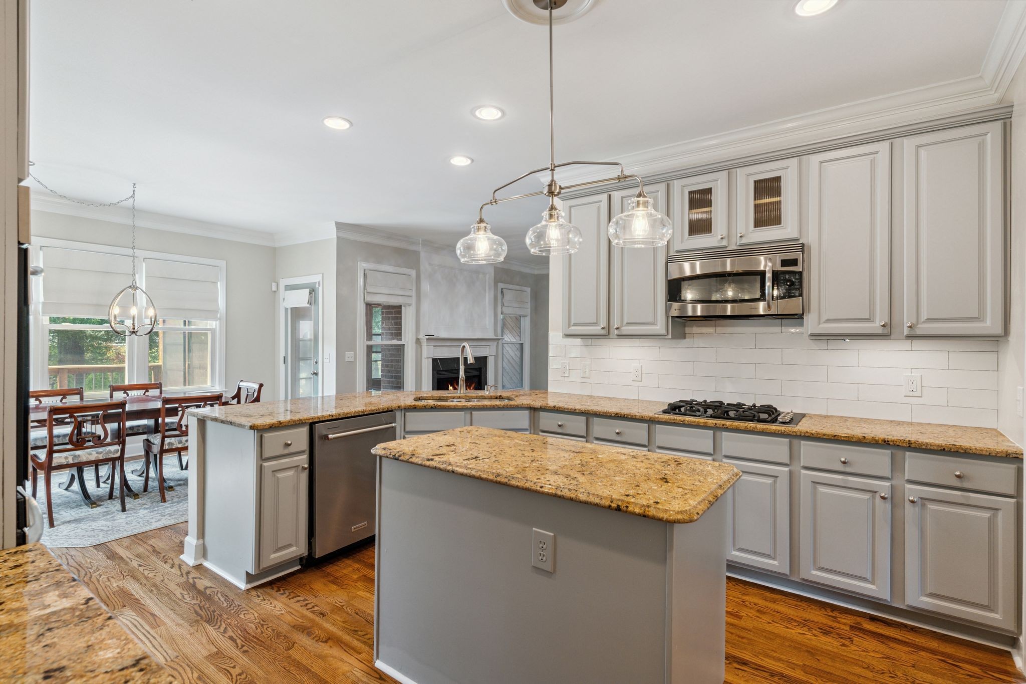 2105 Chels Way Old Hickory, TN 37138 - Photo 16 of 47 a kitchen with kitchen island granite countertop a sink a counter space appliances and cabinets