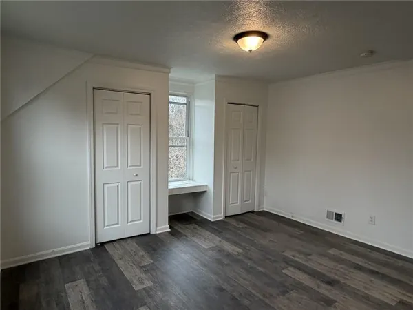 a view of room with hardwood floor