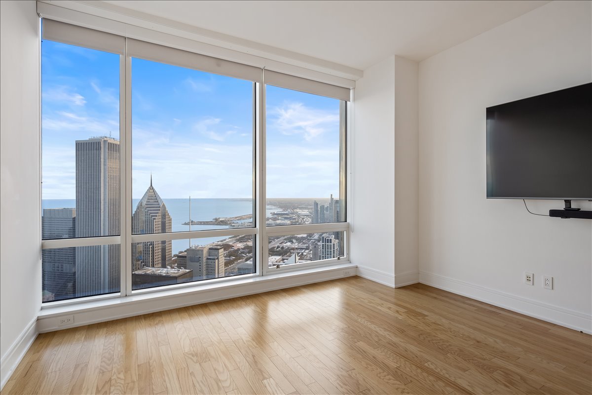 401 North Wabash Avenue, Unit 67F Chicago, IL 60611 - Photo 12 of 44 a view of workspace with window and wooden floor