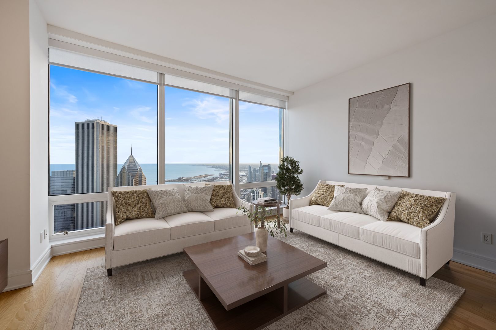 401 North Wabash Avenue, Unit 67F Chicago, IL 60611 - Photo 2 of 44 a living room with furniture and a large window