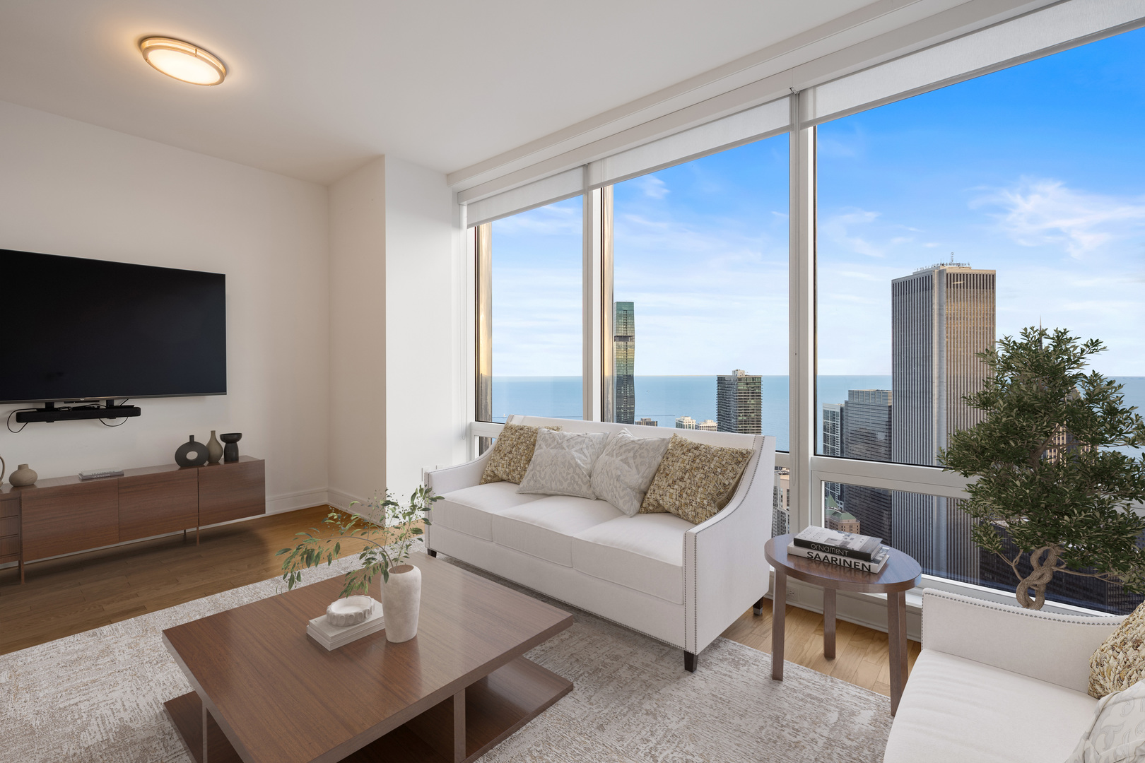 401 North Wabash Avenue, Unit 67F Chicago, IL 60611 - Photo 3 of 44 a living room with furniture and a flat screen tv