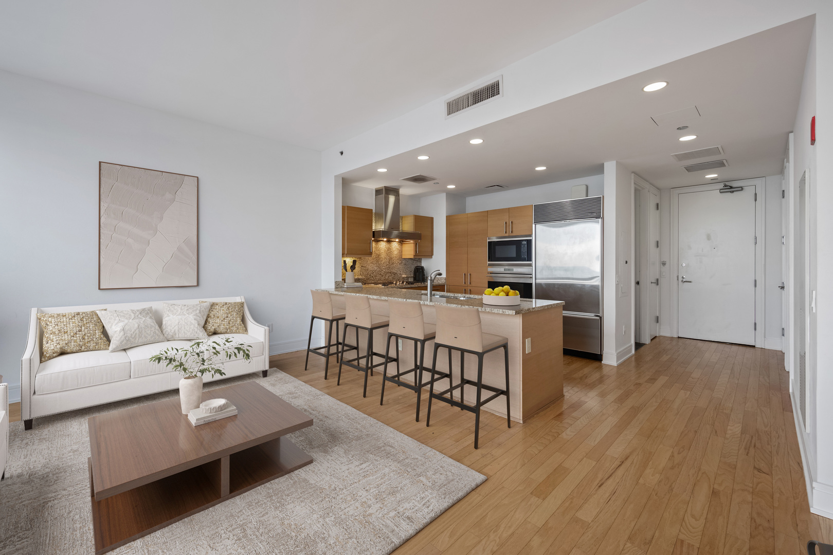 401 North Wabash Avenue, Unit 67F Chicago, IL 60611 - Photo 4 of 44 a living room with furniture and kitchen view