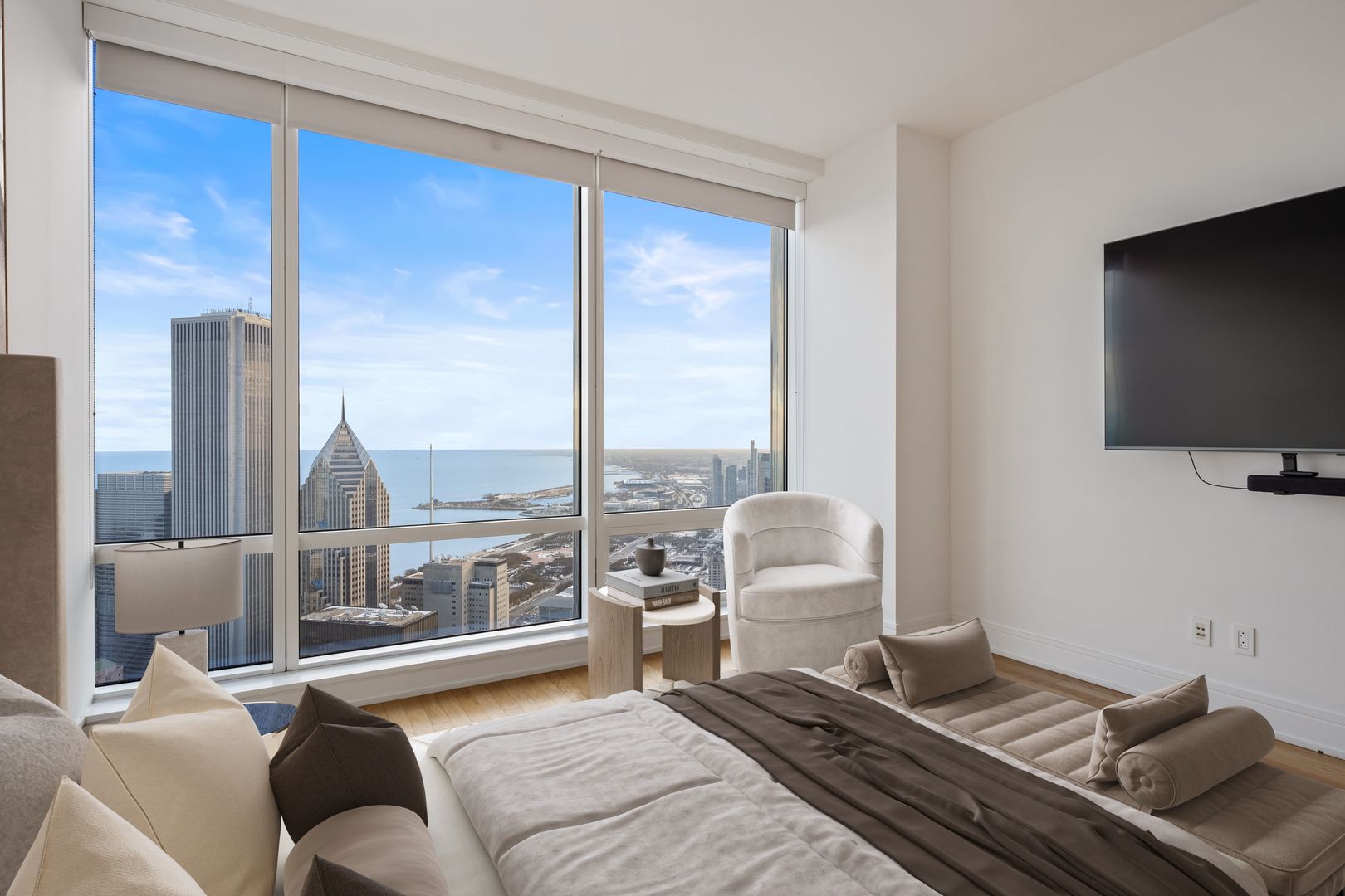 401 North Wabash Avenue, Unit 67F Chicago, IL 60611 - Photo 6 of 44 a living room with furniture and a flat screen tv