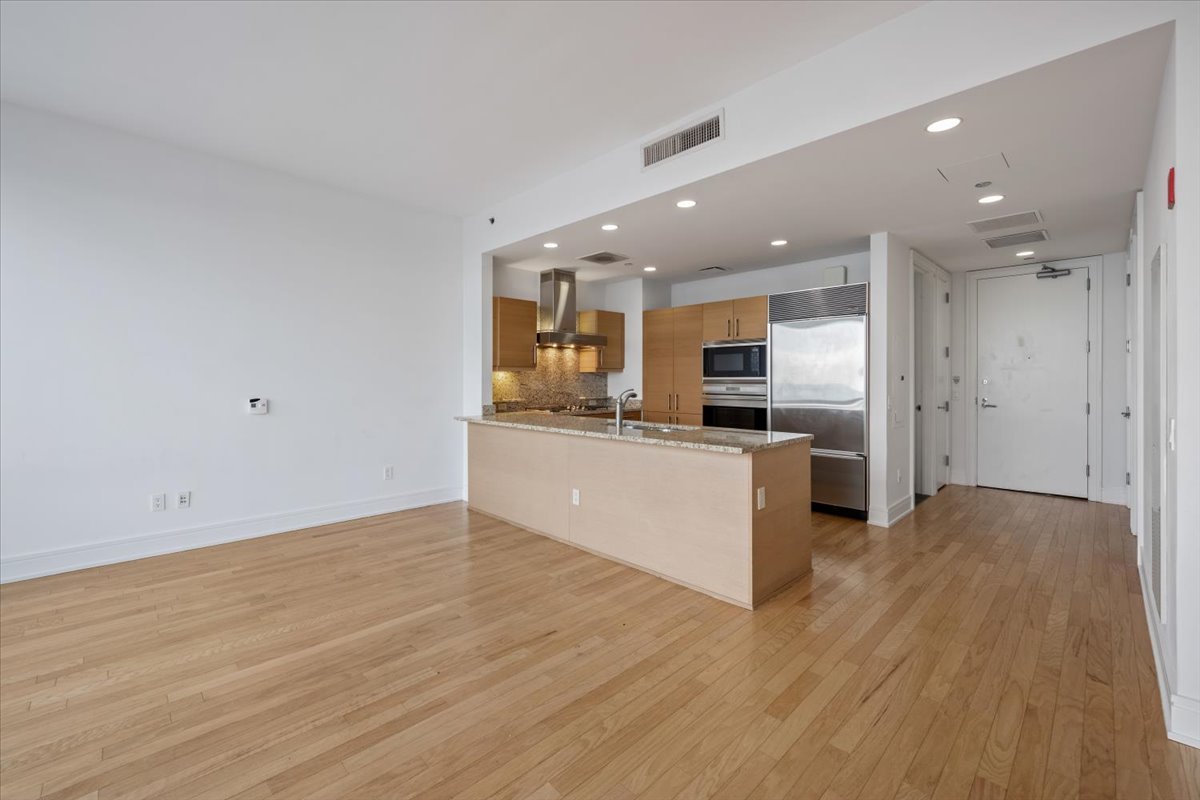 401 North Wabash Avenue, Unit 67F Chicago, IL 60611 - Photo 10 of 44 a view of kitchen with granite countertop cabinets and refrigerator