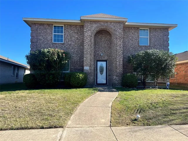 a view of house with yard